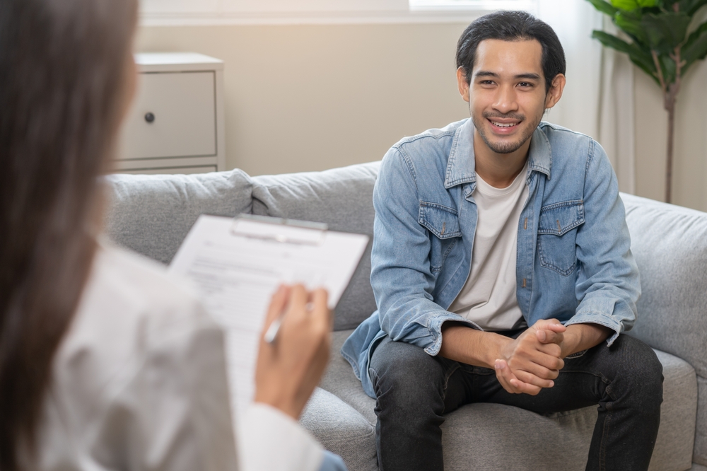 A man participates in therapy at a drug rehab.