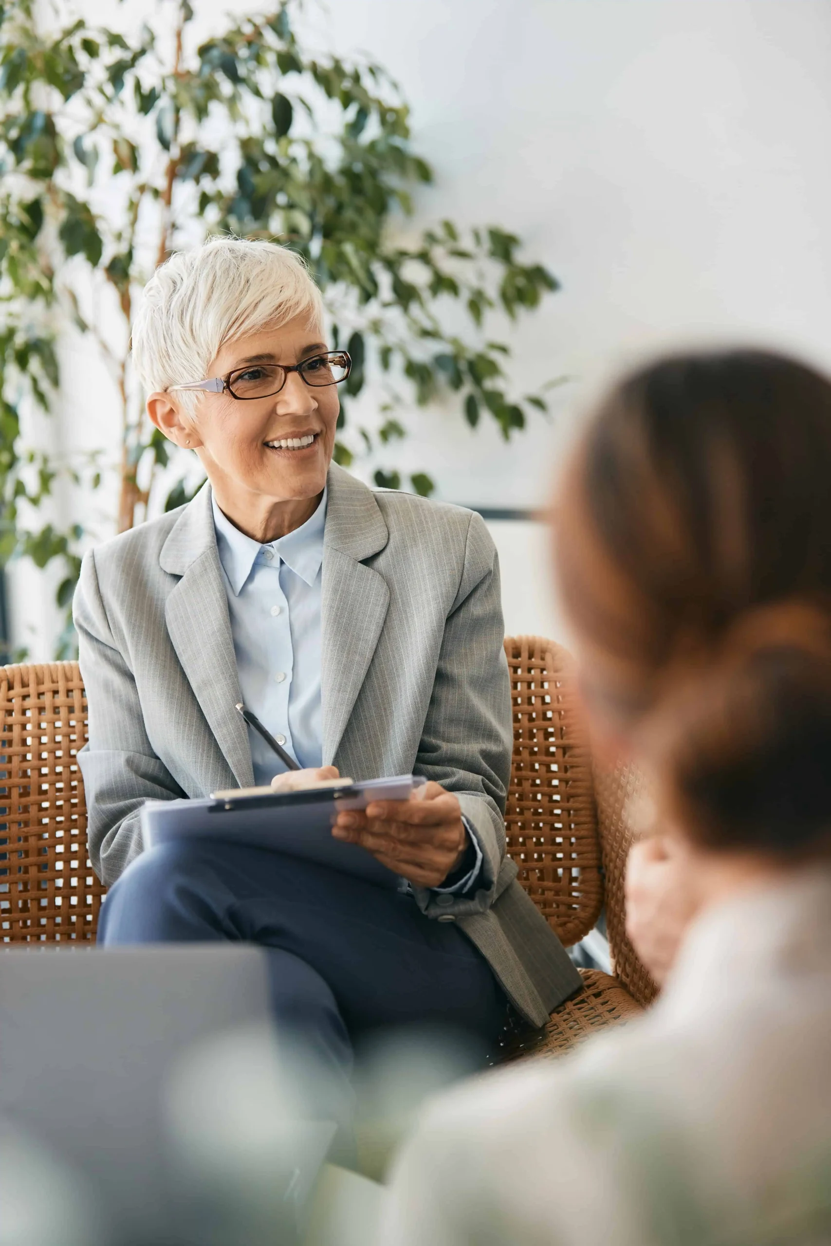 A woman participates in therapy at a drug rehab center.